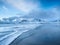 Mountains, beach and wave. Skagsanden beach, Lofoten islands, Norway. Winter landscape near the ocean.