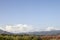 Mountains with Blue Sky and Clouds. Mountain Peak with Green Grass and Blue Sky. Fantastic Shot. Natural Landscape, Meadows and