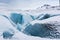 Mountains with clouds on Antarctica. Glaciers, icebergs and ice caves of Southern hemisphere. Global climate change on Earth.