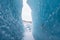 Mountains with clouds on Antarctica. Glaciers, icebergs and ice caves of Southern hemisphere. Global climate change on Earth.