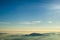 Mountains clouds blue sky and fog photographed from on mountaintop.