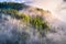 Mountains in clouds at sunrise in summer. Aerial view