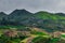 Mountains in the clouds, the villages and the hills with fields. Sabah, Borneo, Malaysia