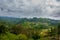 Mountains in the clouds, the villages and the hills with fields. Sabah, Borneo, Malaysia