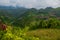 Mountains in the clouds, the villages and the hills with fields. Sabah, Borneo, Malaysia