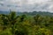 Mountains in the clouds, the villages and the hills with fields. Sabah, Borneo, Malaysia