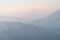 Mountains in a cold haze. Mountain landscape in the fog. Wallpaper