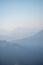 Mountains in a cold haze. Mountain landscape in the fog. Wallpaper