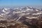 Mountains are covered with glaciers. View from helicopter flight altitude