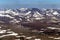 Mountains are covered with glaciers. View from helicopter flight altitude