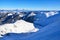 Mountains covered in snow and clouds in valley. Background photo