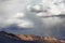 Mountains with dark rainy clouds.