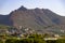 Mountains. Desert of Las Palmas seen from the town of Benicasim, in CastellÃ³n. Mountainous and rocky system with green trees