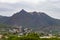 Mountains. Desert of Las Palmas seen from the town of Benicasim, in CastellÃ³n. Mountainous and rocky system with green trees