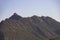 Mountains. Desert of Las Palmas seen from the town of Benicasim, in CastellÃ³n. Mountainous and rocky system with green trees