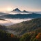 Mountains in fog at beautiful autumn in Phetchabun Thailand. Fog mountain valley, low clouds, forest,