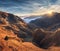 Mountains in fog at beautiful sunset in autumn. Dolomites, Italy