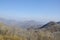 Mountains foggy white blue sky. Chinese autumn mountains.