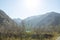 Mountains foggy white blue sky. Chinese autumn mountains.