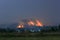 Mountains with forest fires on fire villages and fields, forest fires at night look sad