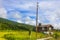 Mountains forests and farmhouses in green meadows norwegian landscape Norway