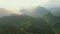 Mountains, green forest and drone with hills, trees and landscape scenery. Outdoor, nature and ecosystem in asia