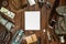 Mountains hiking stuff arranged on wooden floor. Machete, boots, lantern, camera, hat, map, compass. Copy space. Camping concept.