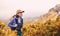 Mountains, hiking and woman thinking of nature journey, travel and outdoor adventure in bush or plants. Young person in