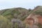 Mountains and hills on the coast of the river Volga. Beautiful patterns of rocks, meadows, green grass and trees. Beautiful spring