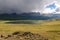 Mountains lake overcast storm clouds sunlight