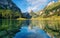 Mountains and lake in the Switzerland. Reflection on the water surface.