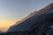 Mountains of Little Cottonwood Canyon in Utah at sunset with snow