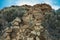 Mountains near Teide National Park. Natural pyramid of volcanic rocks in the habitat of endemic vegetation. Mountain El Sombrero,