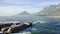 Mountains, ocean and seaside with rocks, drone and sky with clouds, earth hills and travel with top view. Cape Town