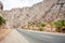 Mountains over the nice asphalt road with amazing colorful rocks