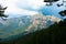 Mountains with rain clouds and fir trees in the Bavella region in Corsica, France.