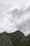 Mountains with rainy grey ominous clouds