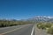 Mountains range with snow peaks and road