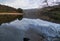 Mountains reflected in a still waters of lake Llyn Gwynant