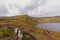 Mountains with rocks and peatland around Lough Bray lower lake in Wicklow mountains