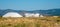 Mountains of salt being harvested with heavy machinery and conveyor belts