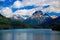 Mountains with snow above blue lake