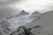 Mountains in snow in cloudy weather