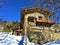 Mountains, snow, and fairytale house