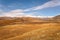 Mountains steppe aerial view autumn snow clouds