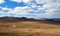 Mountains, steppe and sky with beautiful clouds. Autumn nature. Mongolia.