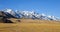 Mountains and steppes on the slopes in a mountain valley on an autumn morning