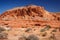 Mountains surrounding Fire wave during wonderful sunny day with blue sky, in Valley of Fire State Park, Nevada