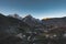 Mountains surrounding a small berber village in Morocco during sunrise sunset. Snow capped mountain panorama. Blue sky