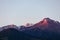 Mountains of the Trans-Ili Alatau in the semi-darkness before sunrise, slightly illuminated by the sunrise